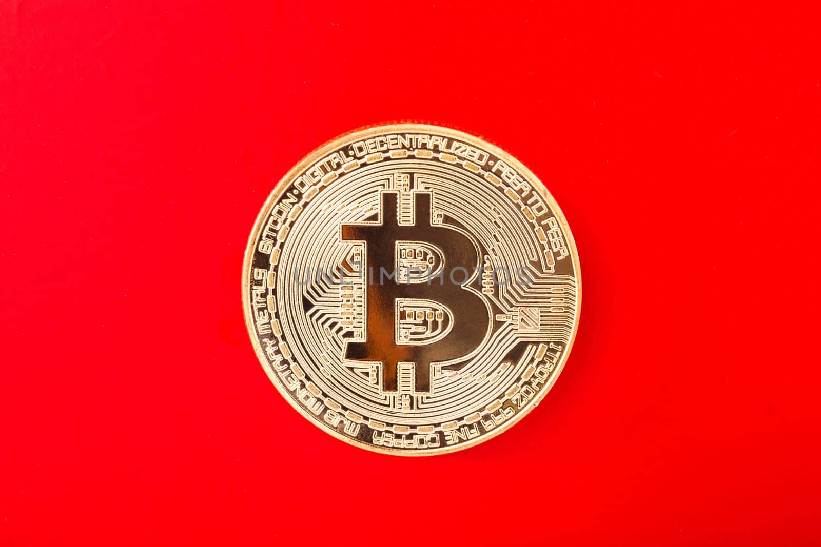 Bitcoin exposed on red background