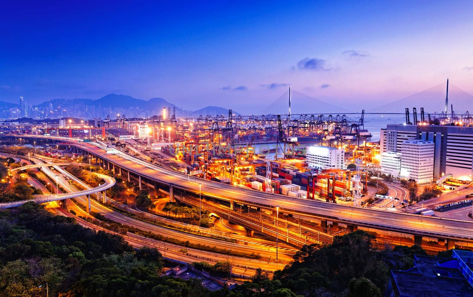 container terminal and stonecutter bridge in Hong Kong at sunset
