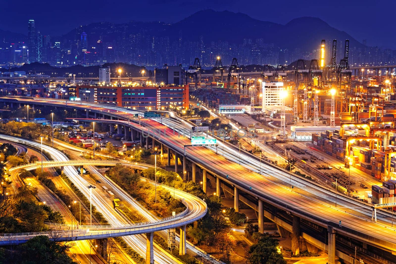 container terminal and stonecutter bridge in Hong Kong at sunset