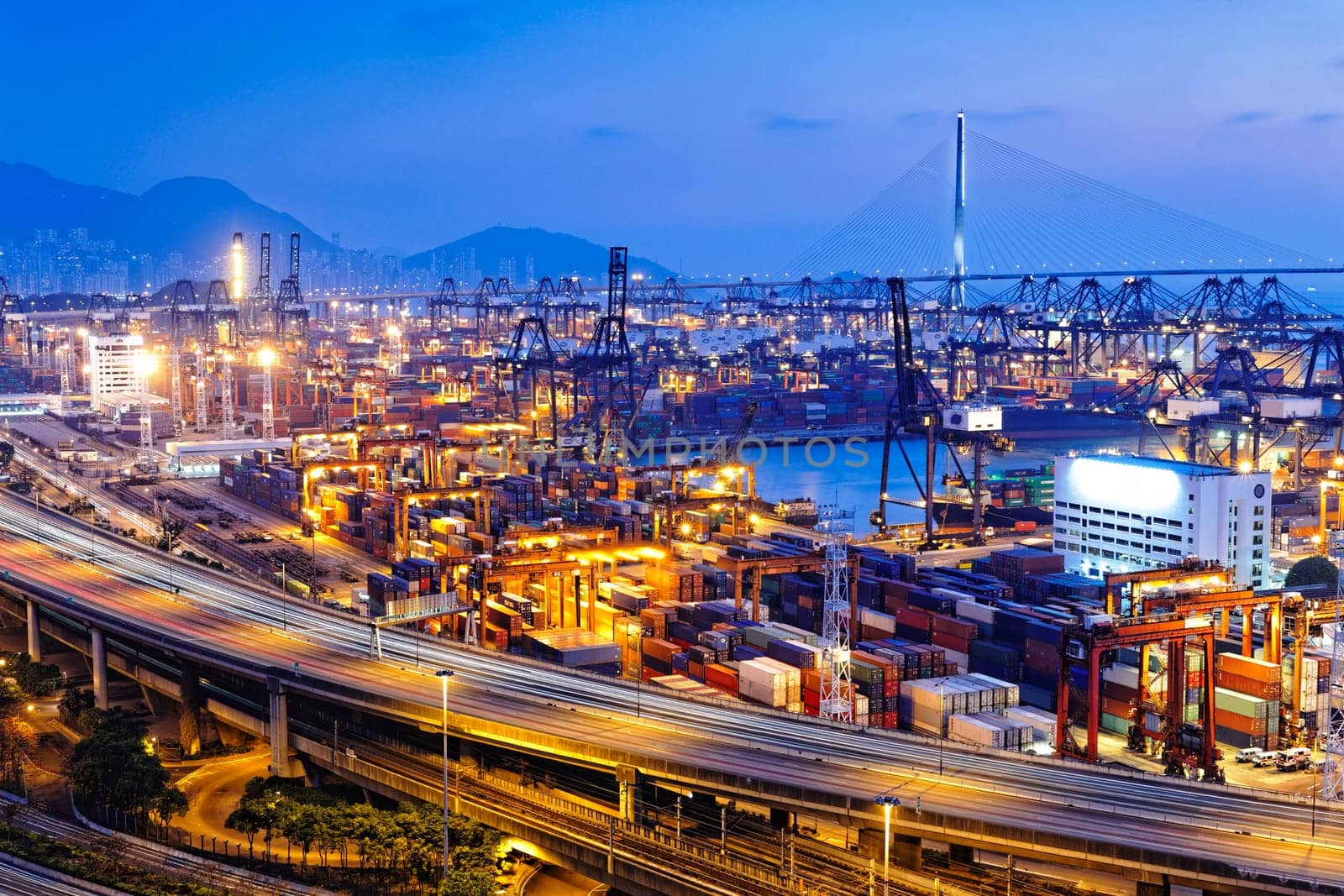 container terminal and stonecutter bridge in Hong Kong at sunset