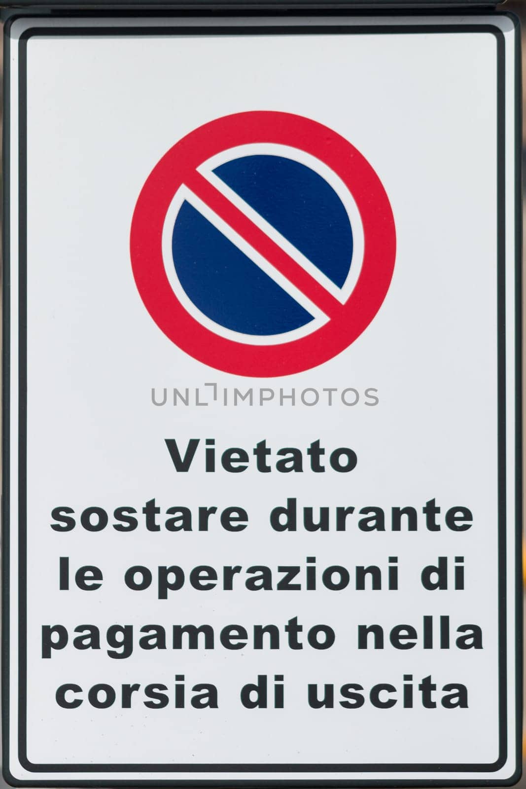 Metal sign with directions and instructions in Italian