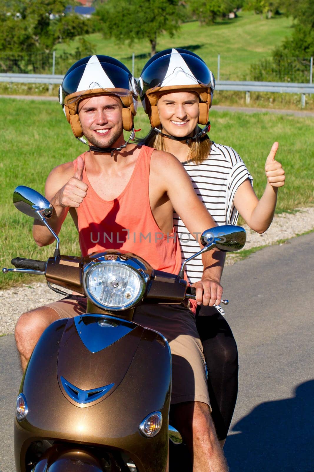 Young couple with scooter