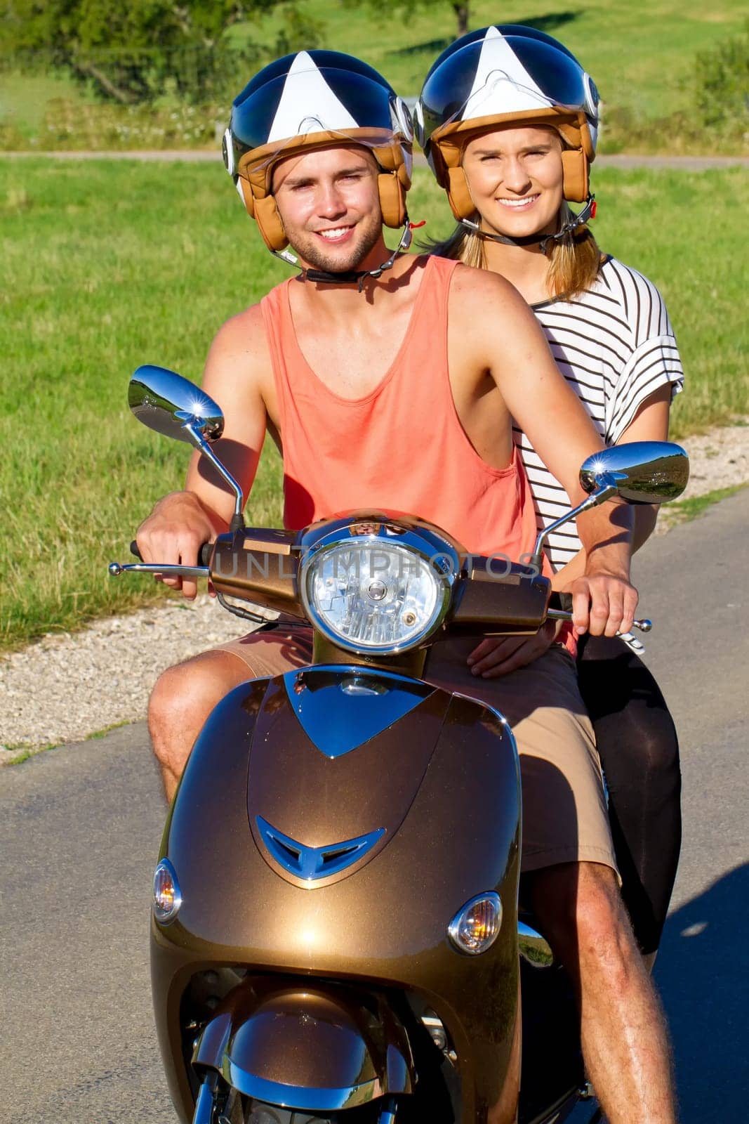 Young couple with scooter