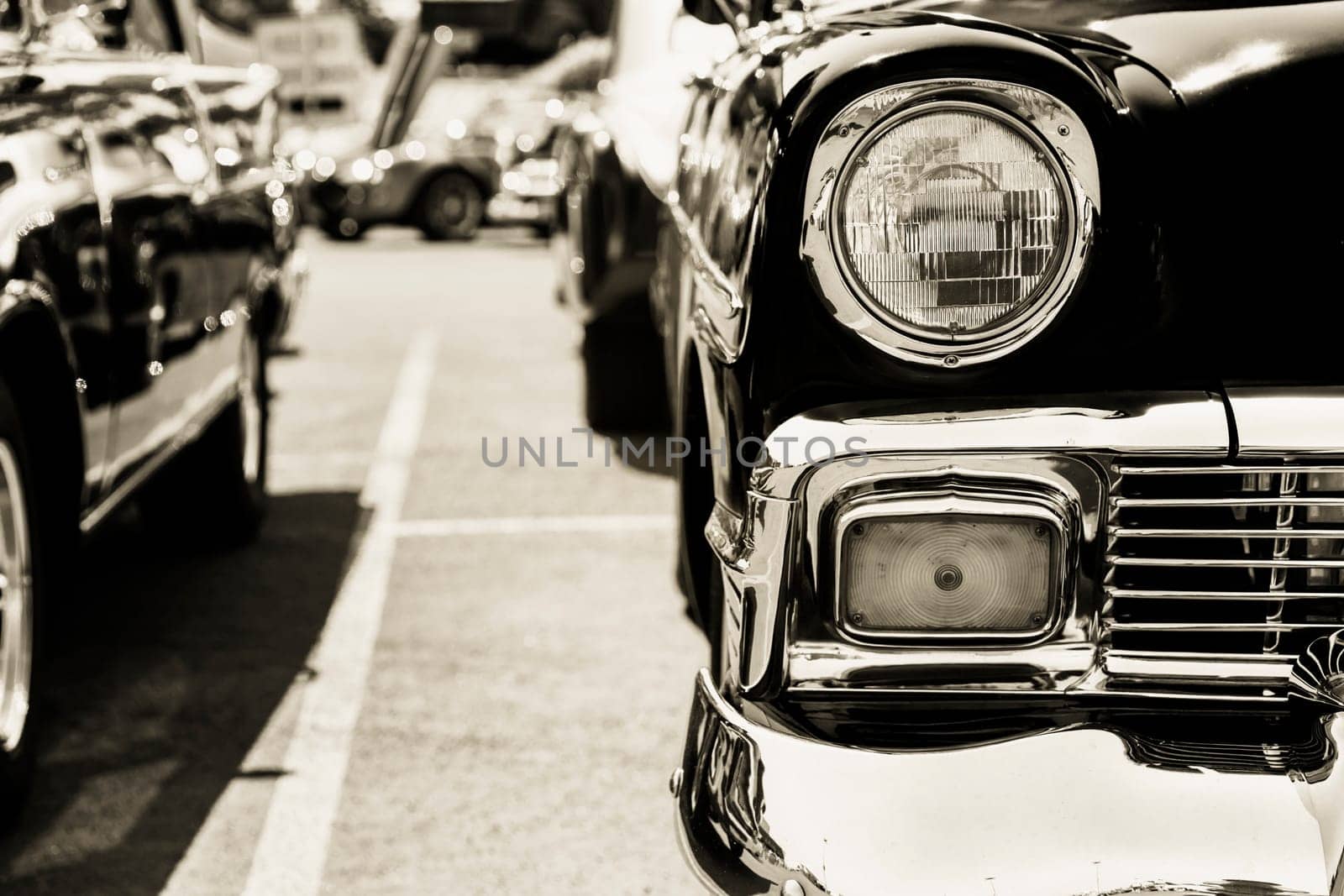 Photograph of a classic vehicle with close-up on headlights.