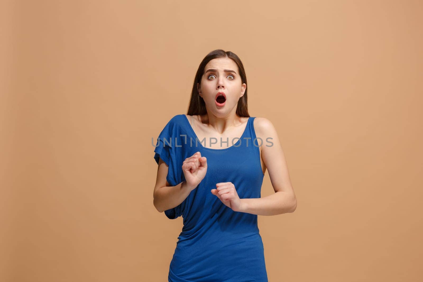 I'm afraid. Fright. Portrait of the scared woman. Business woman standing isolated on trendy pastel studio background. Female half-length portrait. Human emotions, facial expression concept. Front view