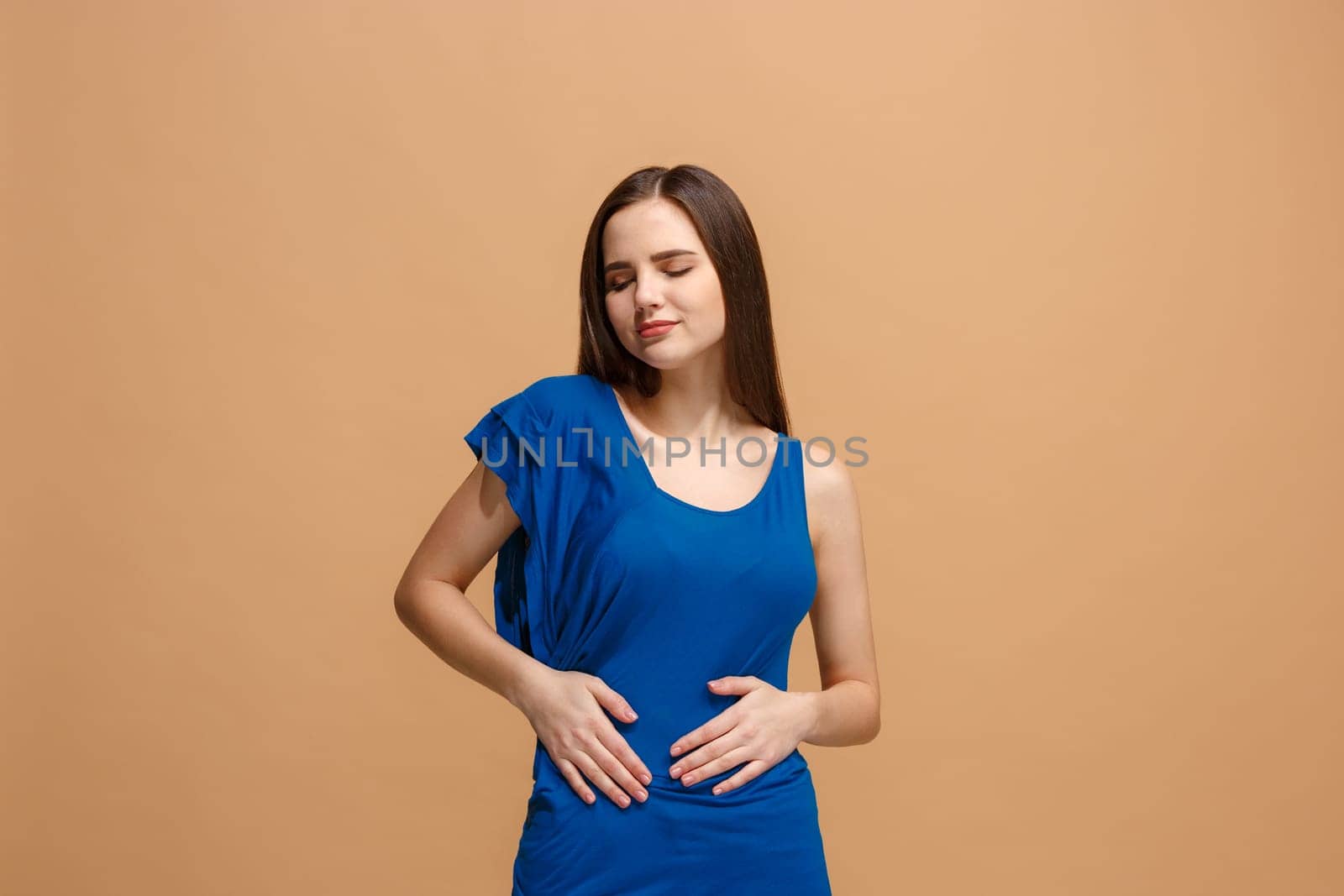 Happy business woman standing, smiling isolated on trendy pastel studio background. Beautiful female half-length portrait. Young satisfy woman. Human emotions, facial expression concept. Front view.