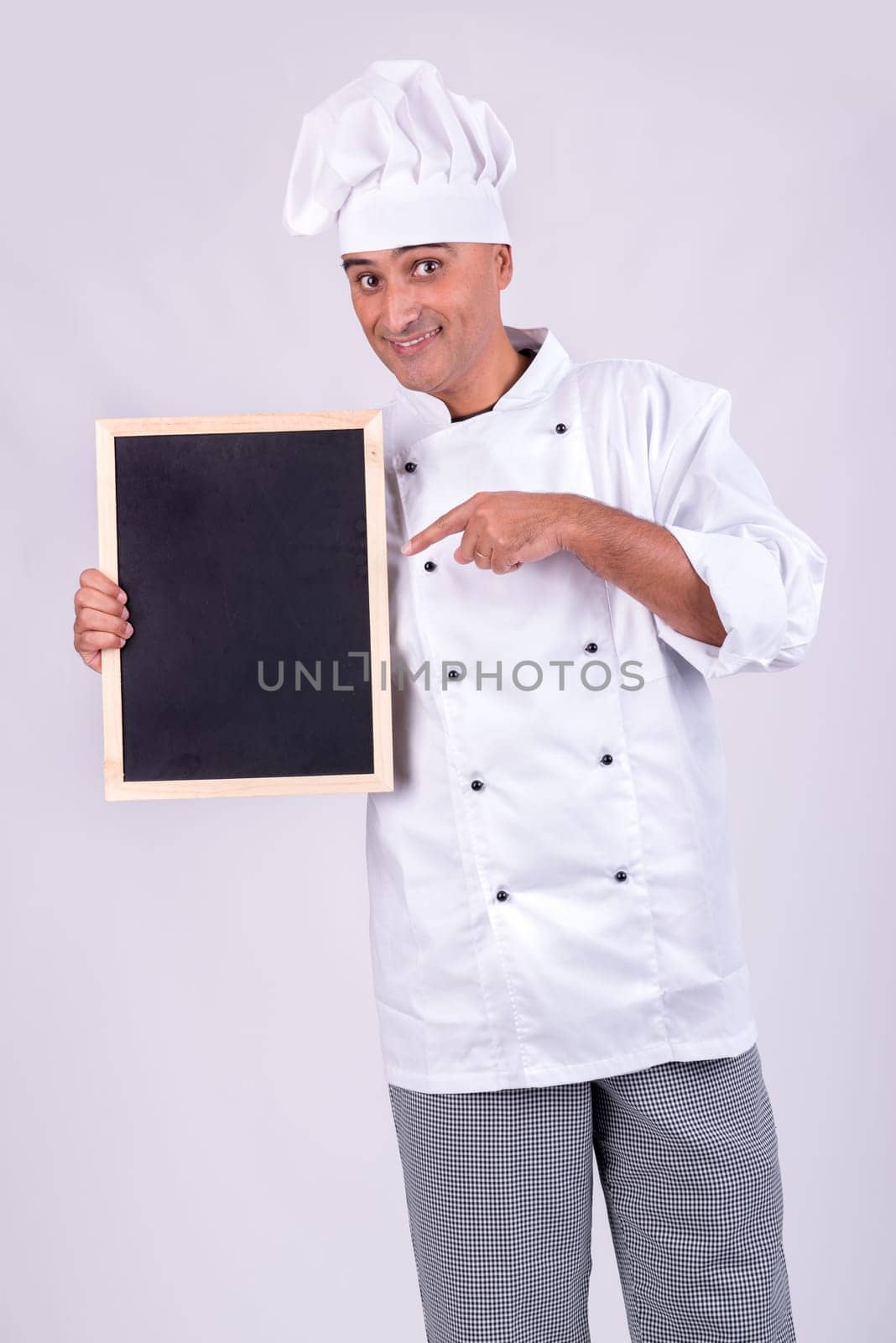 Male Chef with a menu board