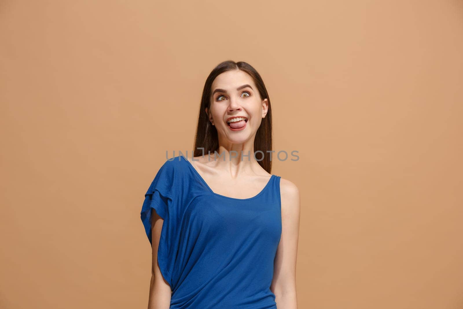 I lost my mind. The woman with weird expression. Beautiful female half-length portrait isolated on pastel studio backgroud. The crazy woman. The human emotions, facial expression concept.