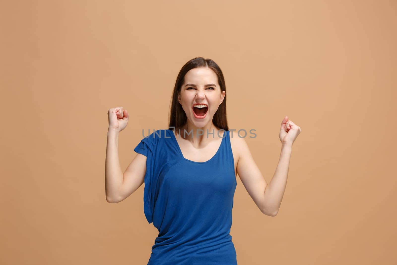 I won. Winning success happy woman celebrating being a winner. Dynamic image of caucasian female model on pastel studio background. Victory, delight concept. Human facial emotions concept. Trendy colors