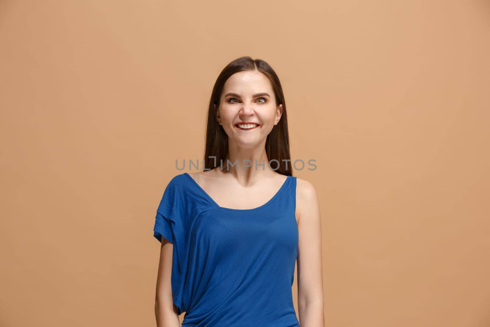 I lost my mind. The woman with weird expression. Beautiful female half-length portrait isolated on pastel studio backgroud. The crazy woman. The human emotions, facial expression concept.