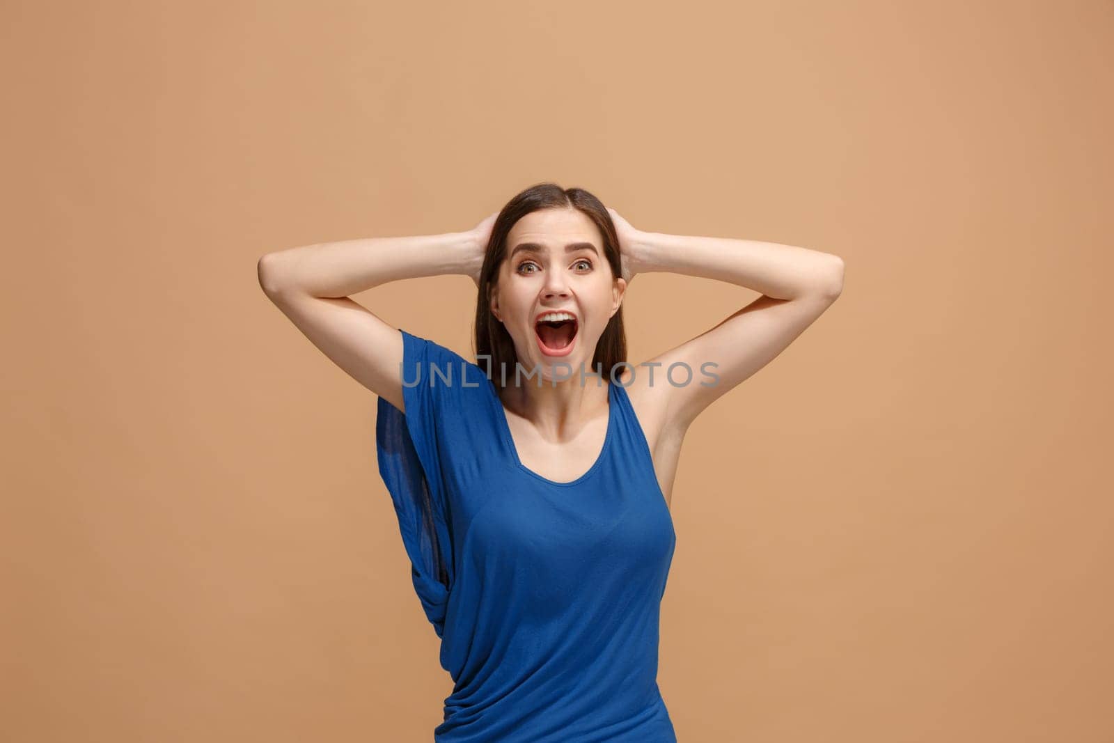 I won. Winning success happy woman celebrating being a winner. Dynamic image of caucasian female model on pastel studio background. Victory, delight concept. Human facial emotions concept. Trendy colors
