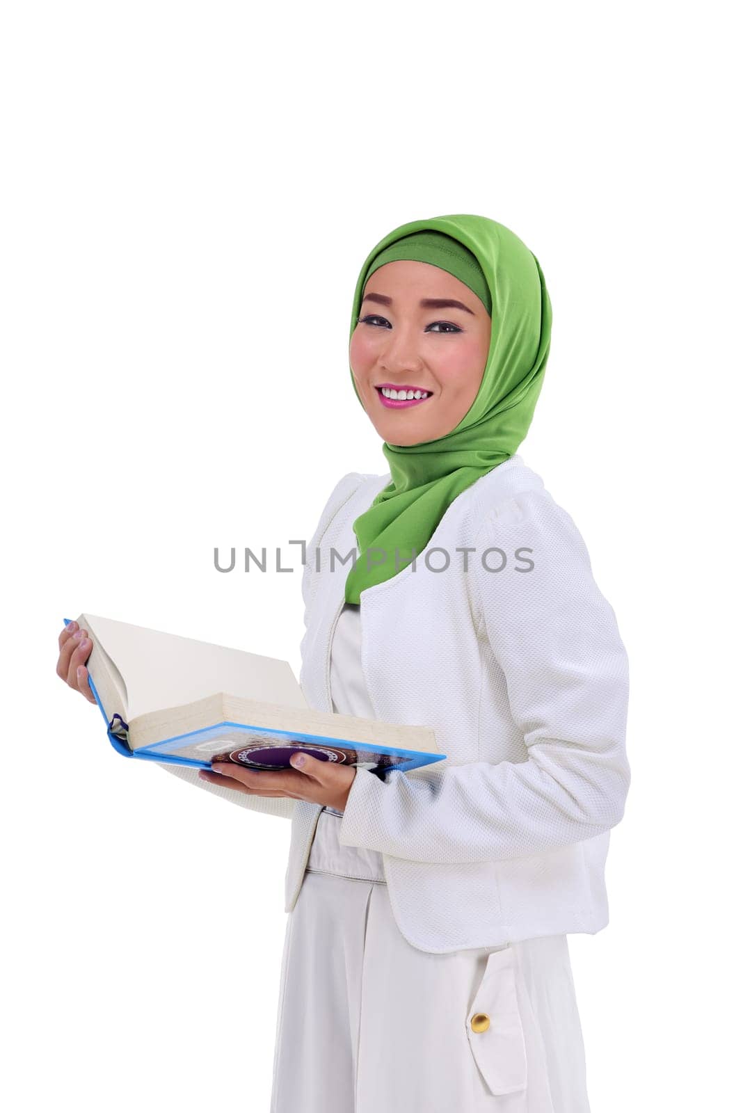 Portrait asian muslim woman holding koran posing isolated over white background