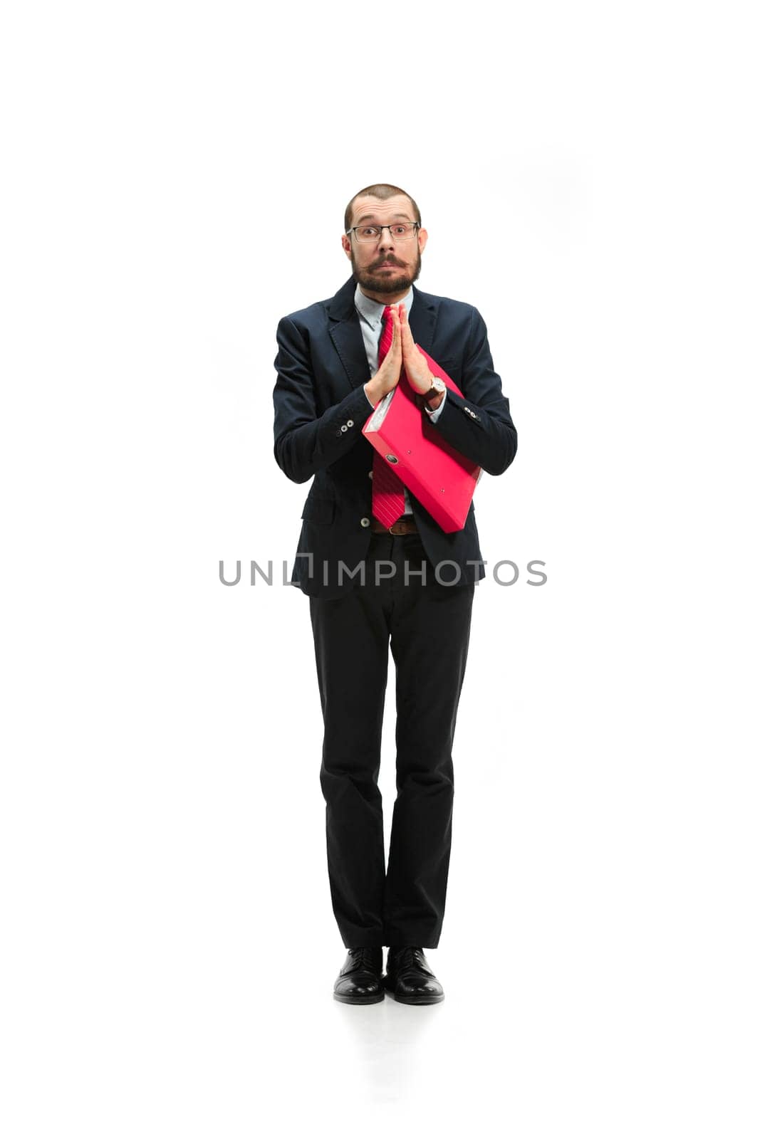 Choose me. Concept of choose the best candidate. Full body view of businessman raising his hand on white studio background. Serious bearded young man in glasses, suit. Business, career concept.