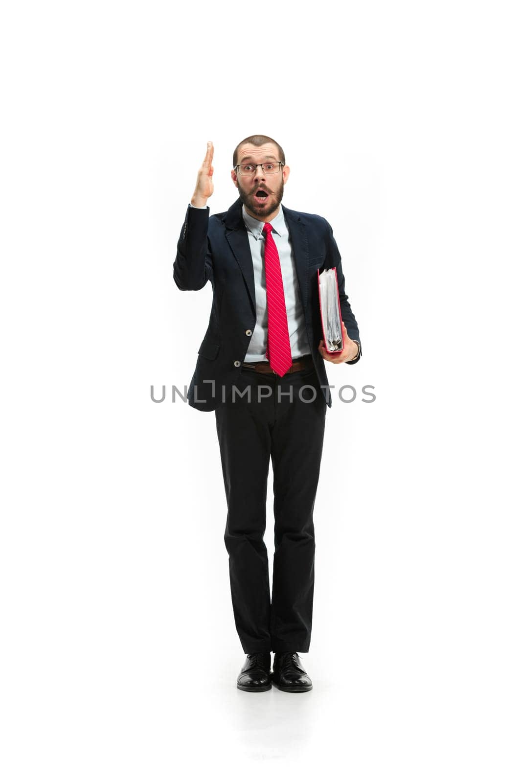 Choose me. Concept of choose the best candidate. Full body view of businessman raising his hand on white studio background. Serious bearded young man in glasses, suit. Business, career concept.