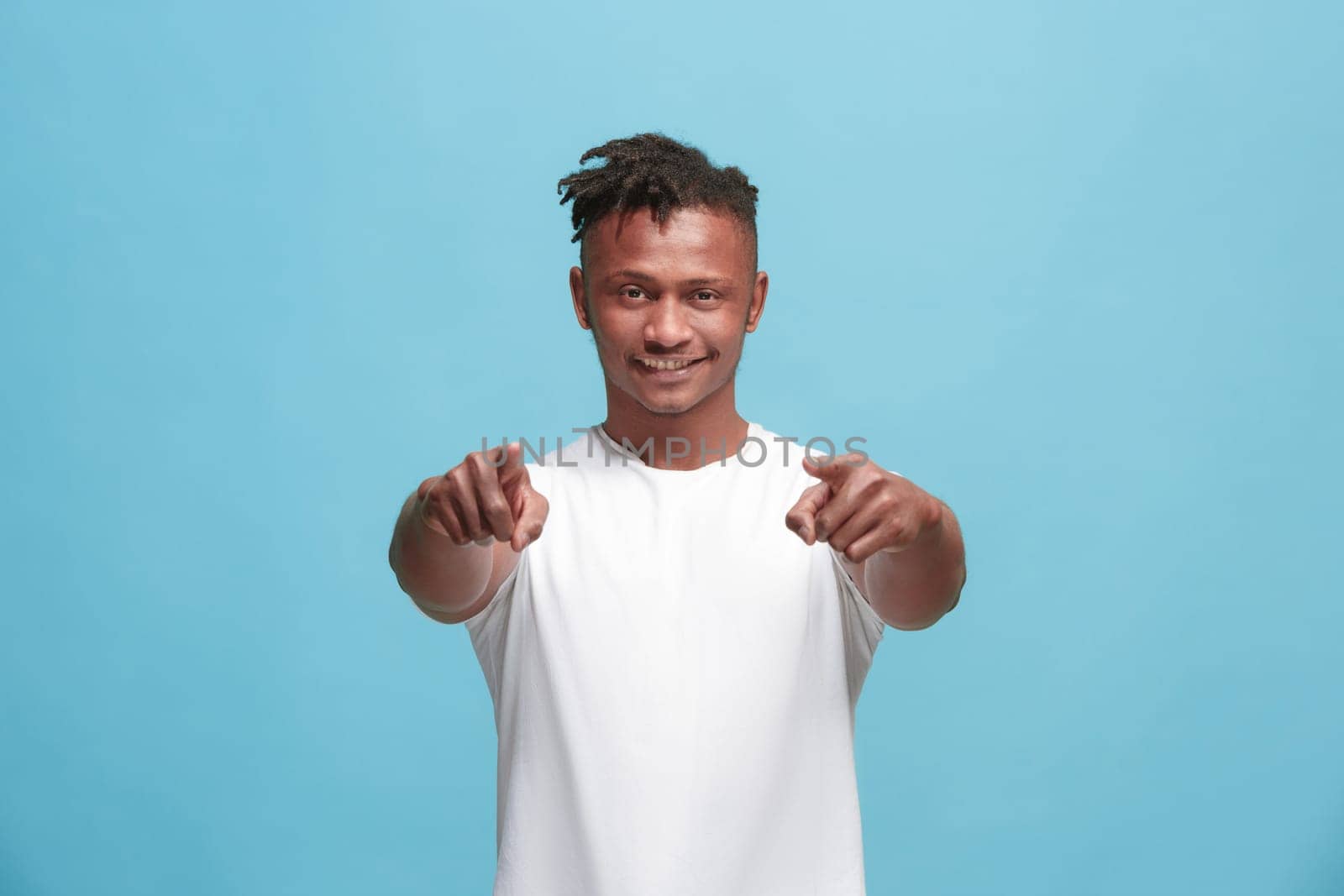 I choose you and order. African american businessman point you, want you, half length closeup portrait on blue studio background. The human emotions, facial expression concept. Front view. Trendy colors