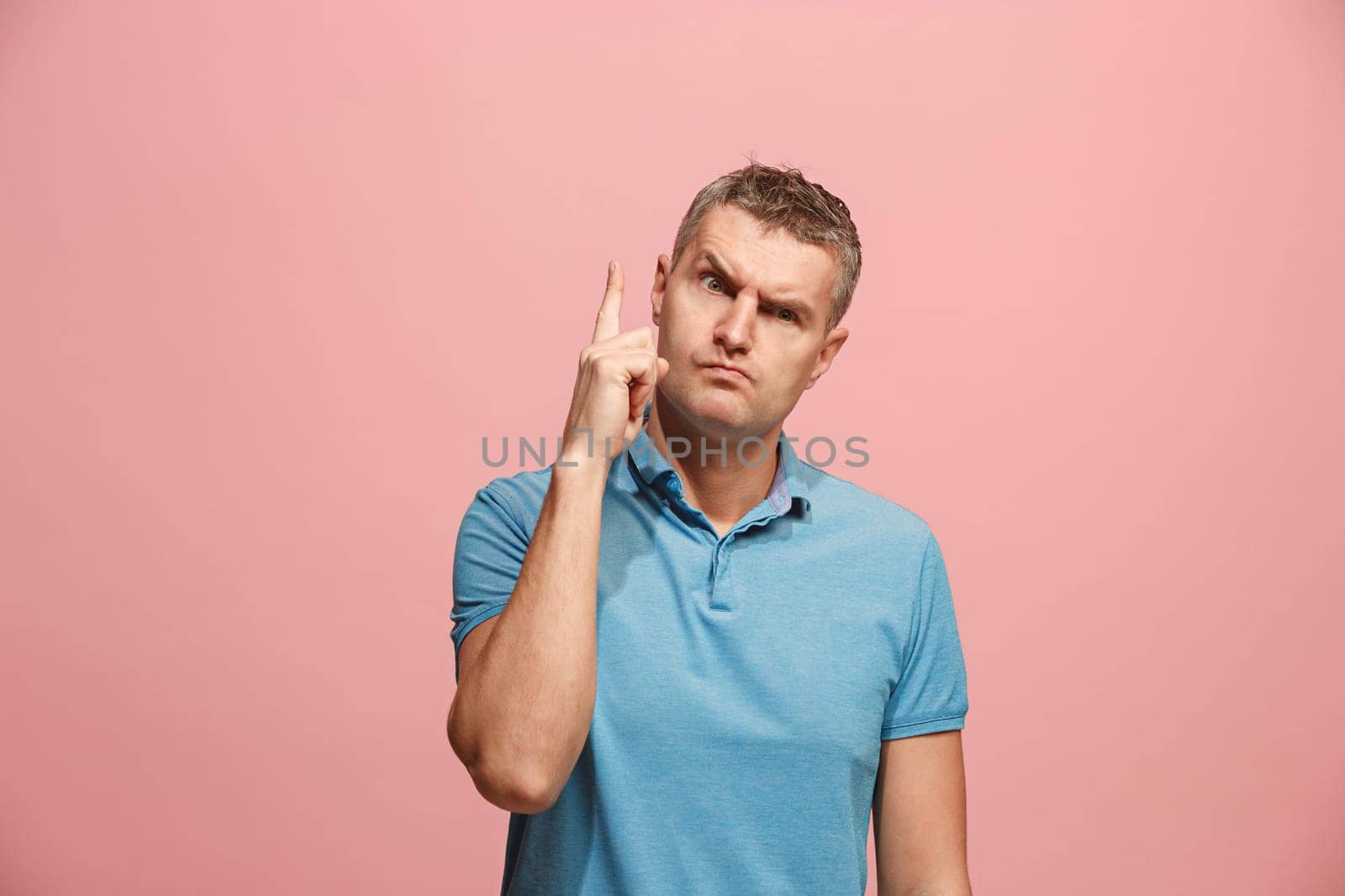 Remember all. Let me think. Doubt concept. Doubtful, thoughtful man remembering something. Young emotional man. Human emotions, facial expression concept. Studio. Isolated on trendy pink. Front