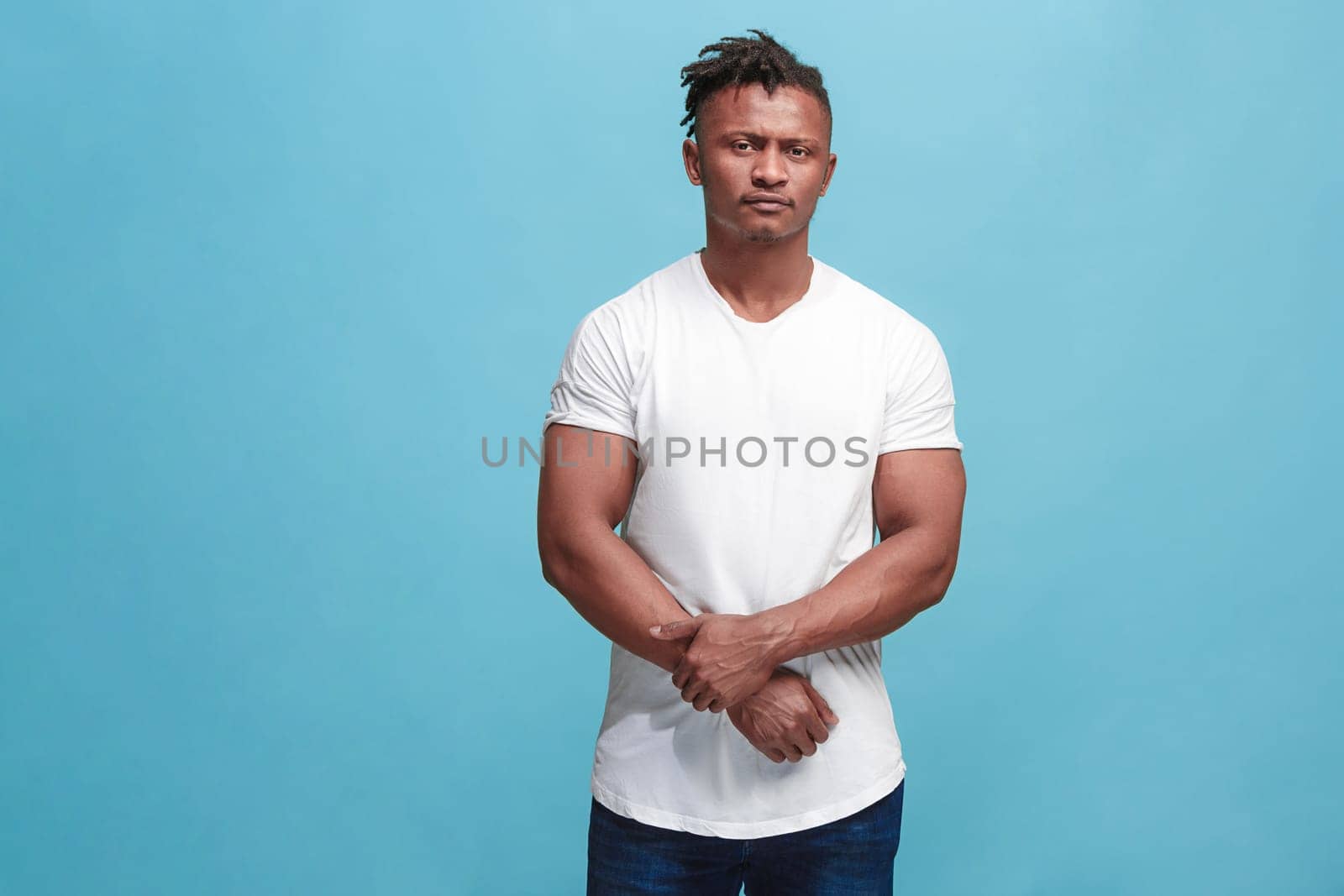 Why is that. Beautiful male half-length portrait isolated on trendy pink studio backgroud. Young emotional surprised, frustrated and bewildered man. Human emotions, facial expression concept.