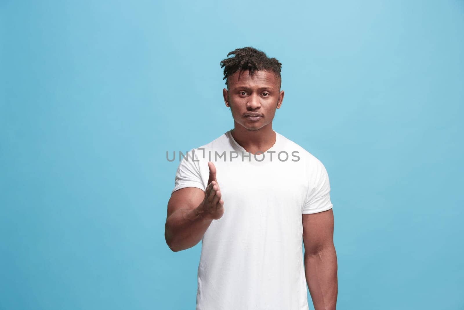 I choose you and order. African american businessman point you, want you, half length closeup portrait on blue studio background. The human emotions, facial expression concept. Front view. Trendy colors