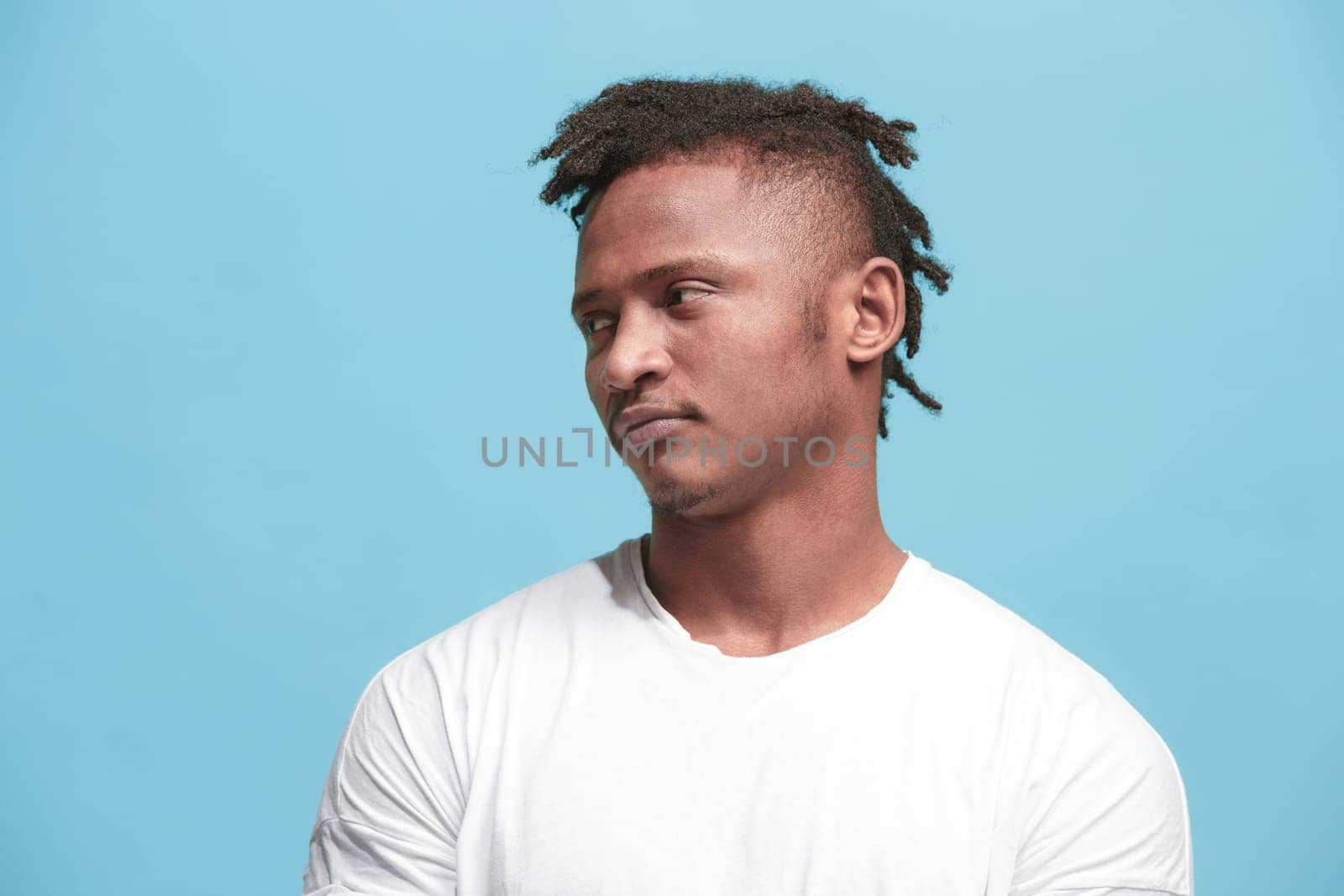 I am tired of everything. Bored man. Boring, dull, tedious concept. Young caucasian emotional man. Human emotions, facial expression concept. Studio Isolated on trendy blue background