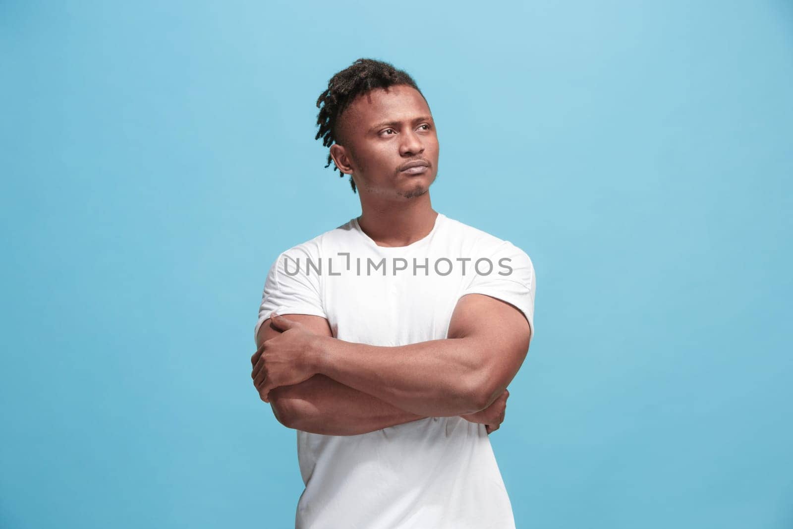 Remember all. Let me think. Doubt concept. Doubtful, thoughtful Afro-Fmerican man remembering something. Young emotional man. Human emotions, facial expression concept. Studio. Isolated on trendy blue