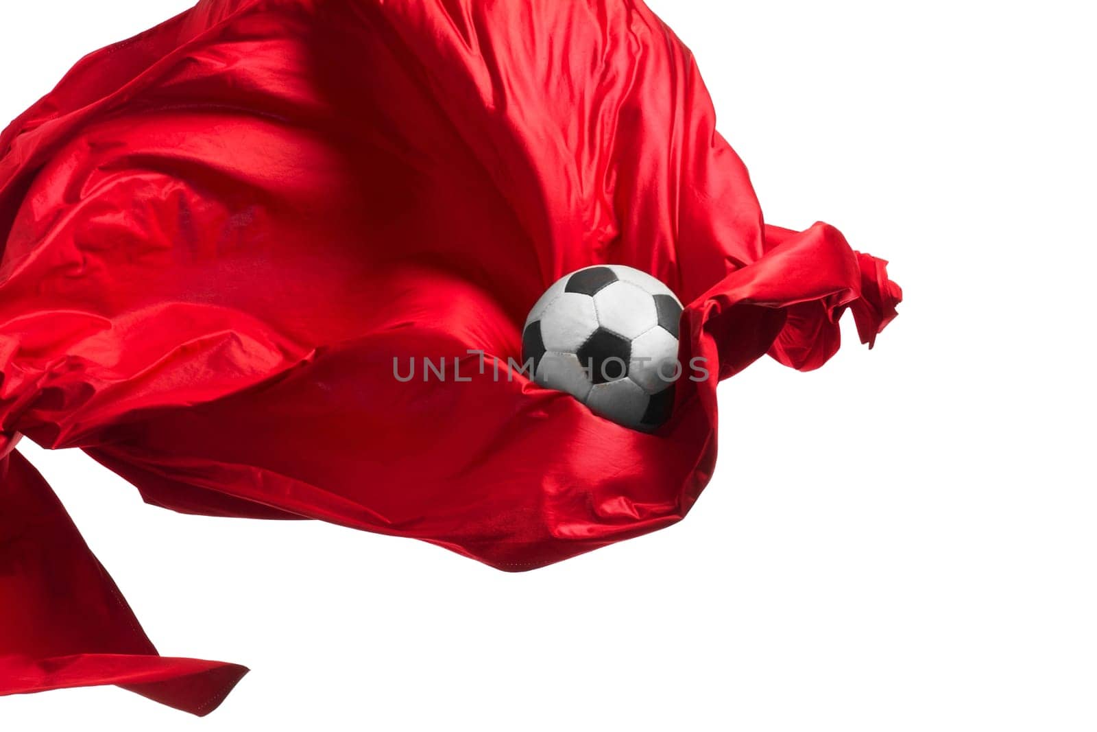 Soccer ball and Smooth elegant transparent red cloth isolated or separated on white studio background. Texture of flying fabric. red. Attributes of popular game. Concept of national flag color