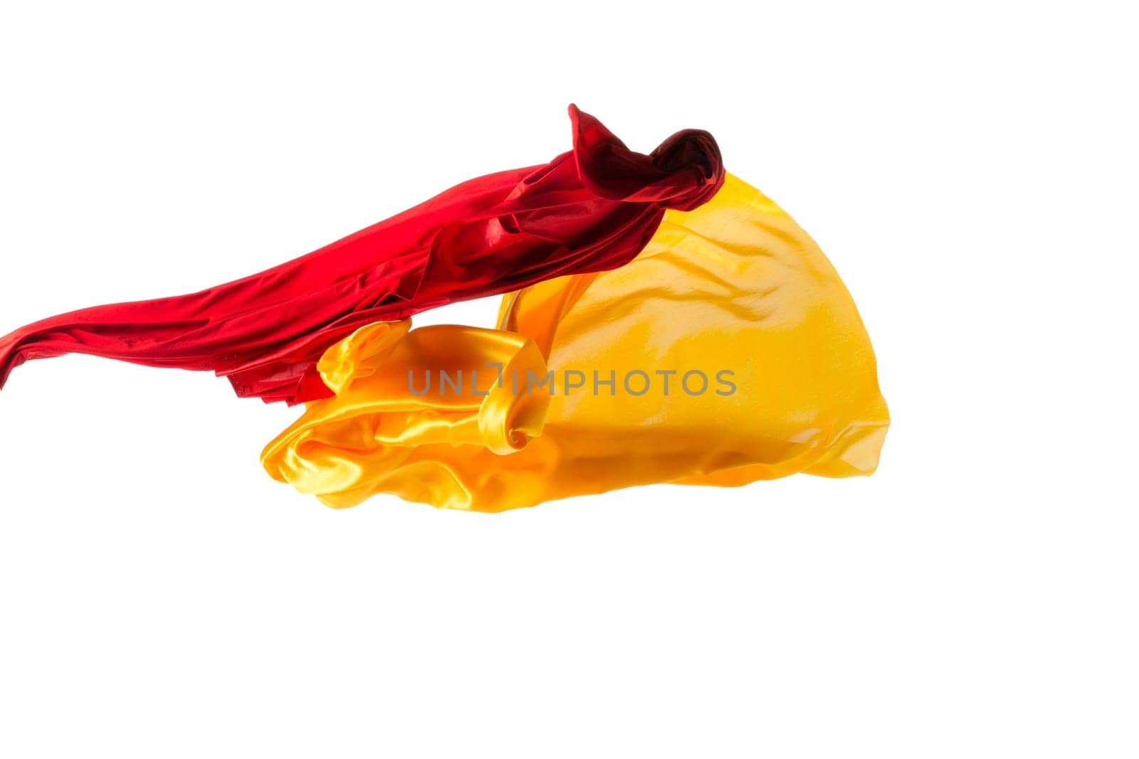 Smooth elegant transparent yellow, red, cloth isolated or separated on white studio background. Texture of flying fabric.