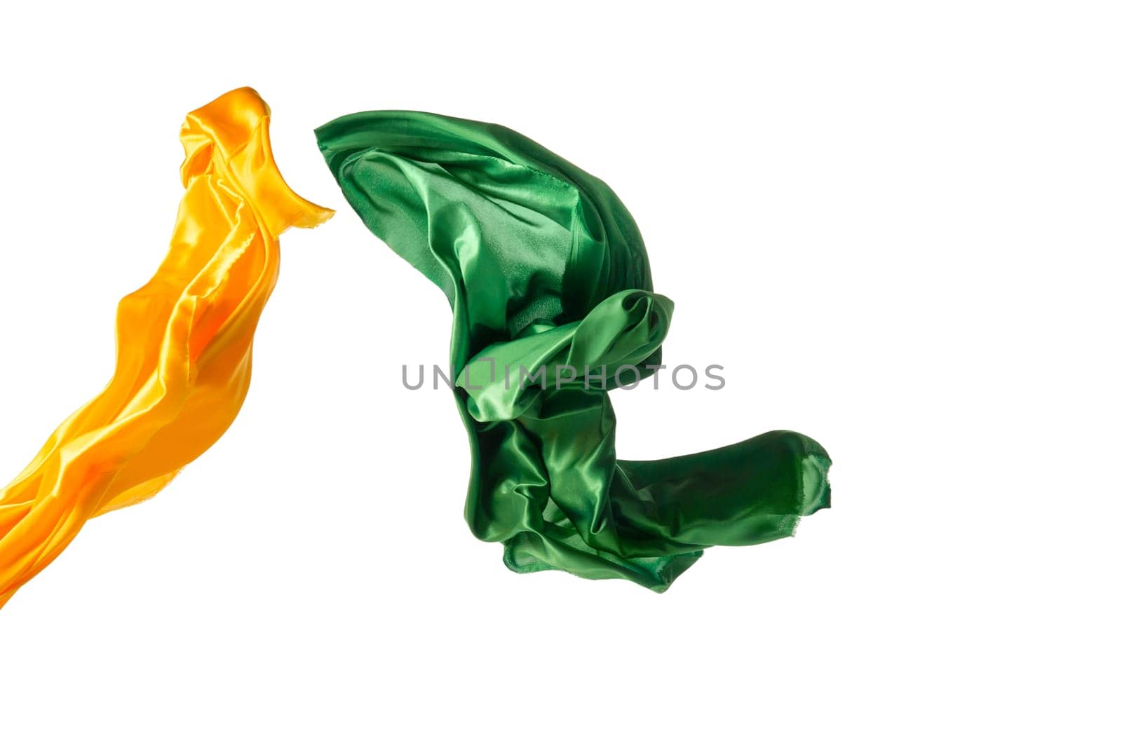 Smooth elegant transparent yellow, green cloth isolated or separated on white studio background. Texture of flying fabric.