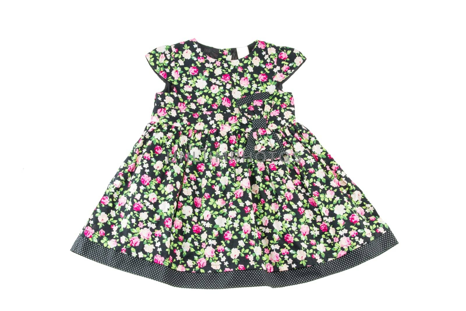 Fashionable dress of the little girl. Beauty and style in children's clothing.On a white background