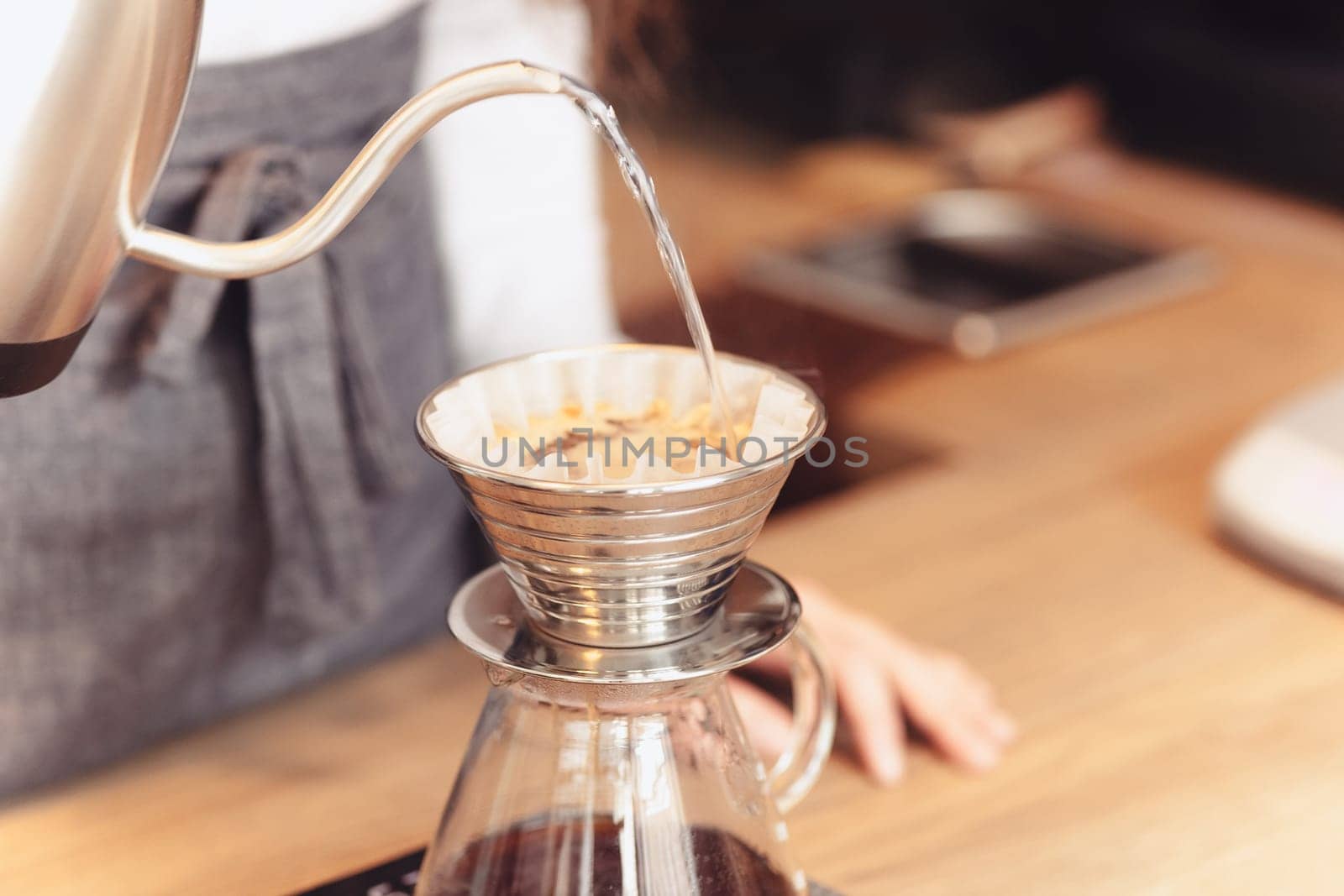 Barista, cafe, making coffee, preparation and service concept. Female hands at work. The hipster stile