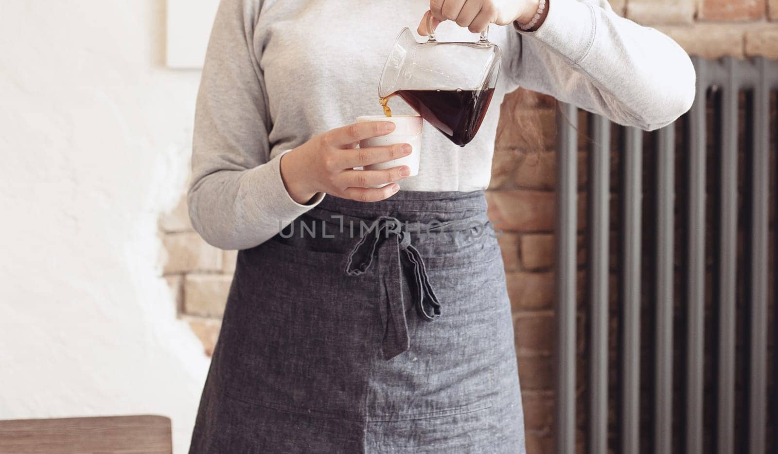 Barista, cafe, making coffee, preparation and service concept. Female hands at work. The hipster stile