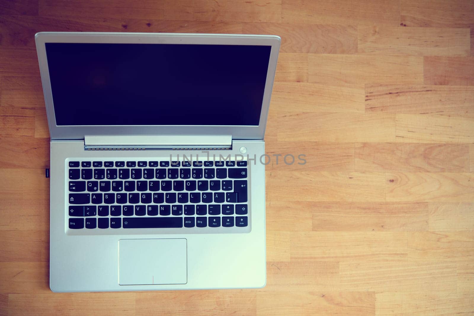 laptop from above on wooden ground