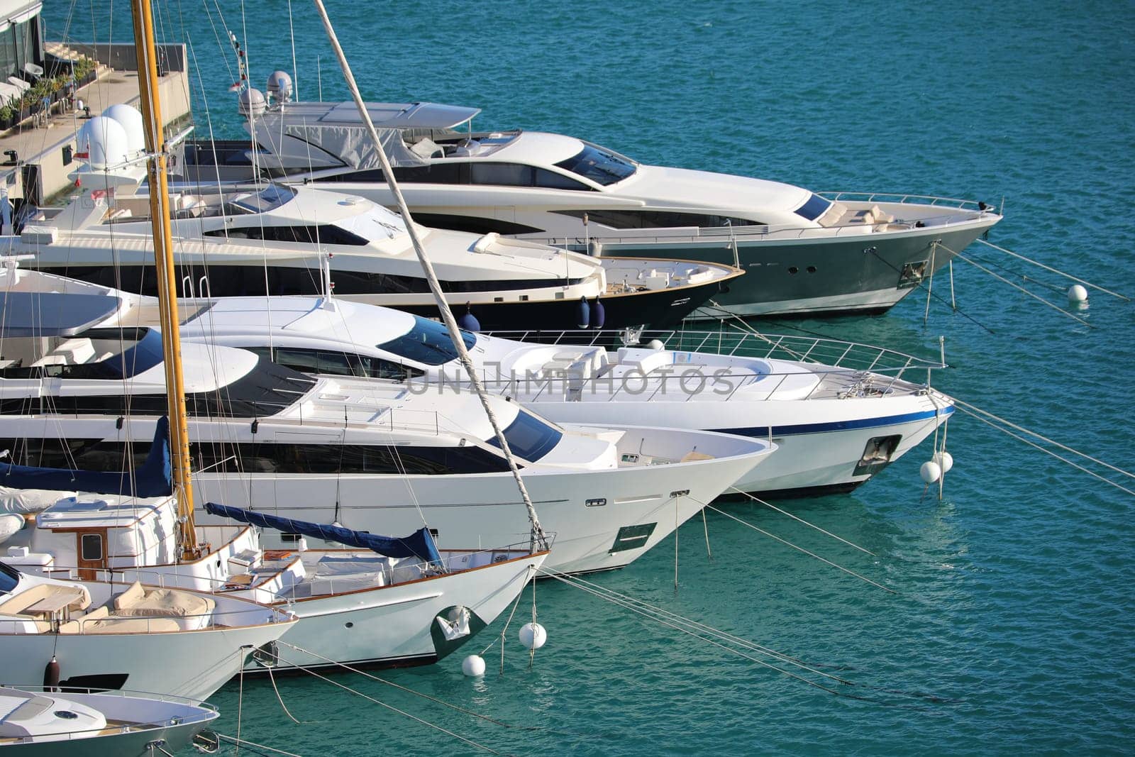 Monte-Carlo, Monaco - March 17, 2018: Luxurious Yachts And Megayachts Lined Up In The Monte-Carlo Harbour (Port Hercule), French Riviera