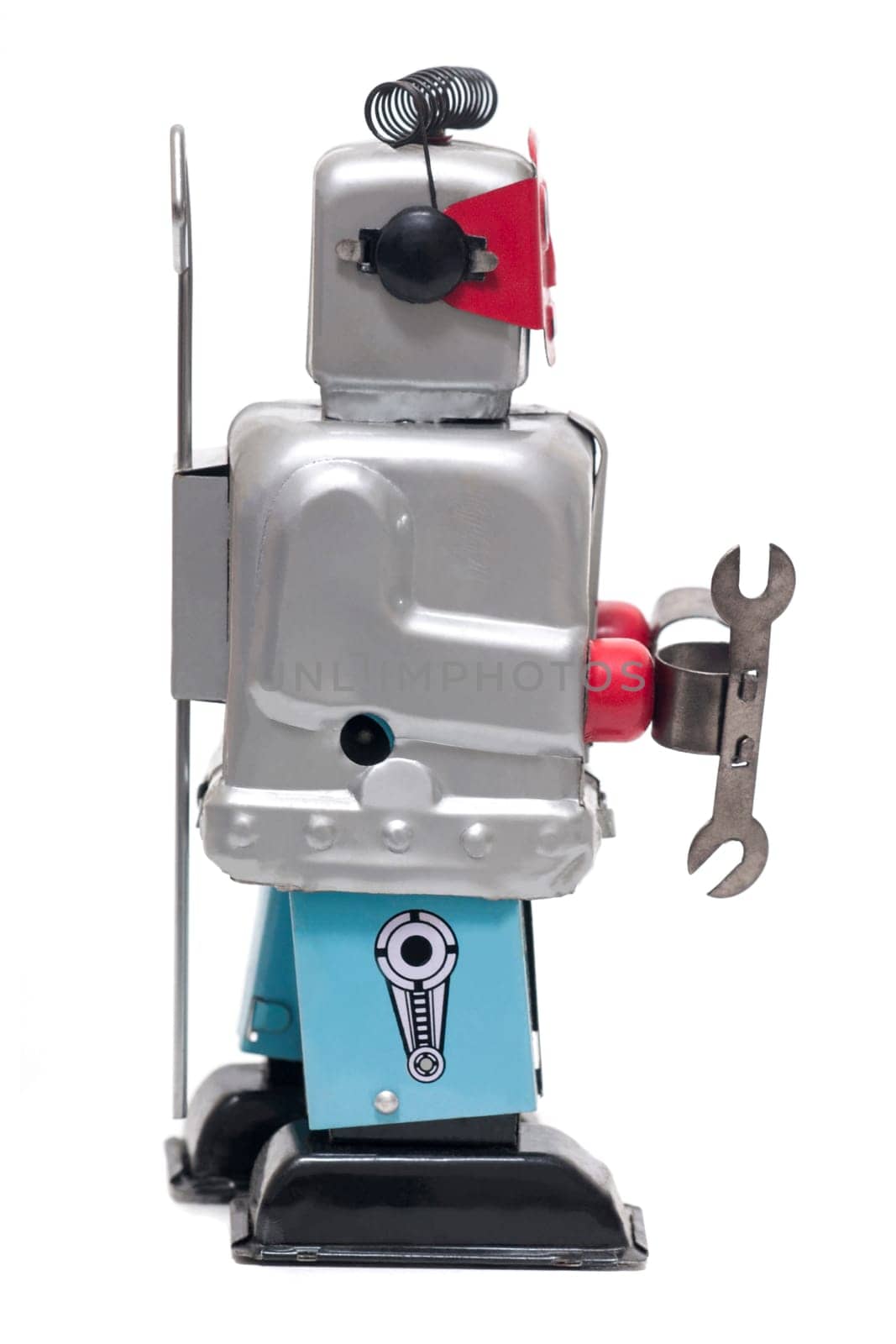 Vintage retro red face tin toy robot isolated on a white background.