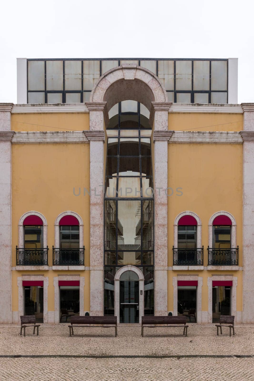 View of a tall and modern historical building in Faro city.