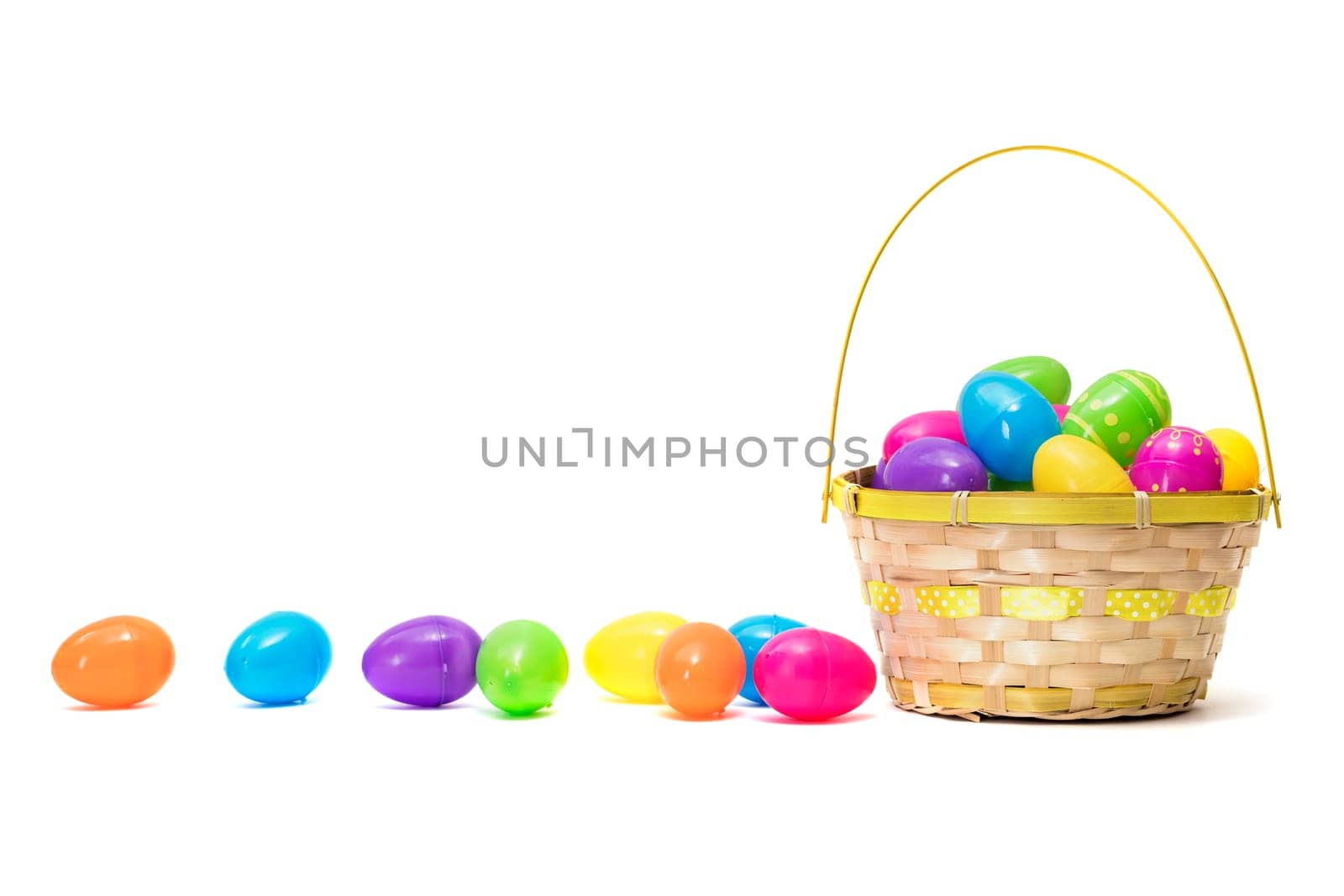 Easter eggs in basket isolated on white background