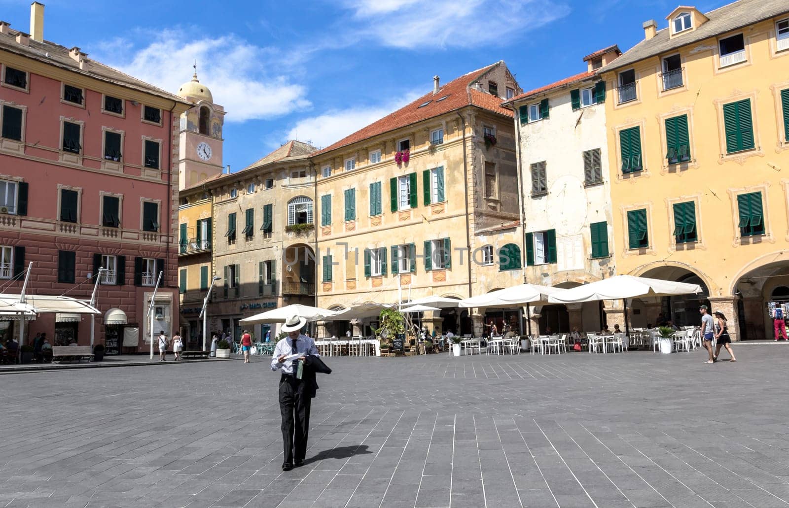 Finale Ligure (SV), ITALY - August 24, 2017: Piazza Vittorio Emanuele II in Finale Ligure ITALY. On the square there are several palaces with seventeenth-century facades and the imposing arch dedicated to Margherita Teresa of Spain. The square is also the main venue for city events.