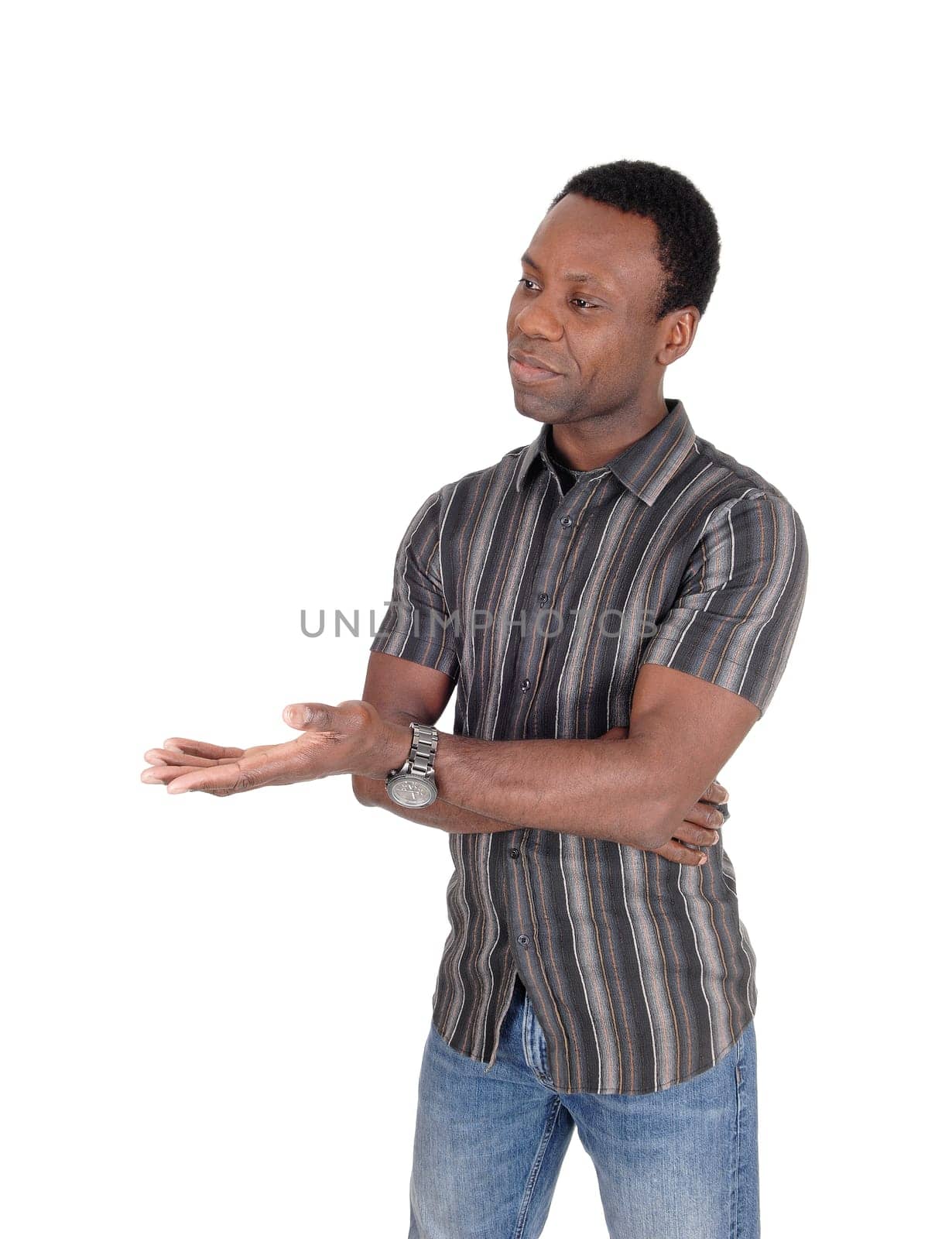 A young handsome African American man standing in a striped shirt.and jeans holding his hand out, isolated for white background.