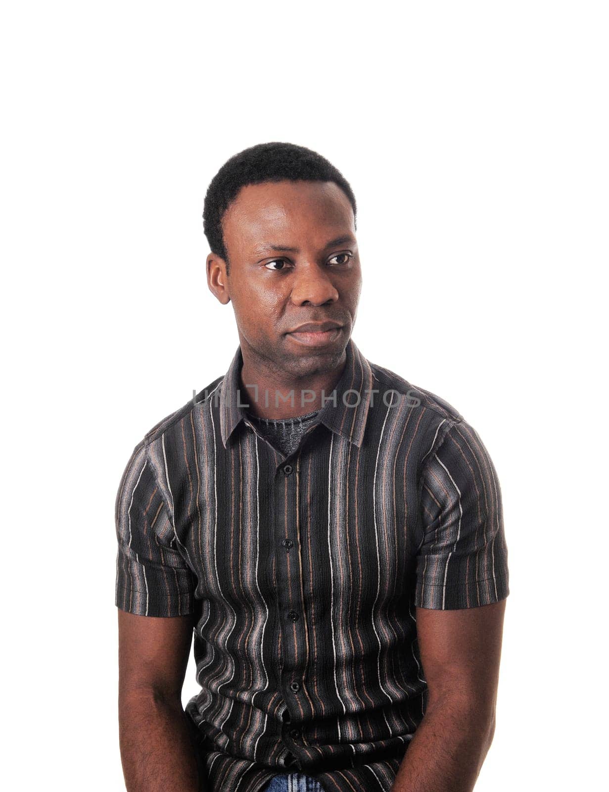 A close up image of an African American man in a striped shirt .und serious look, isolated for white background.