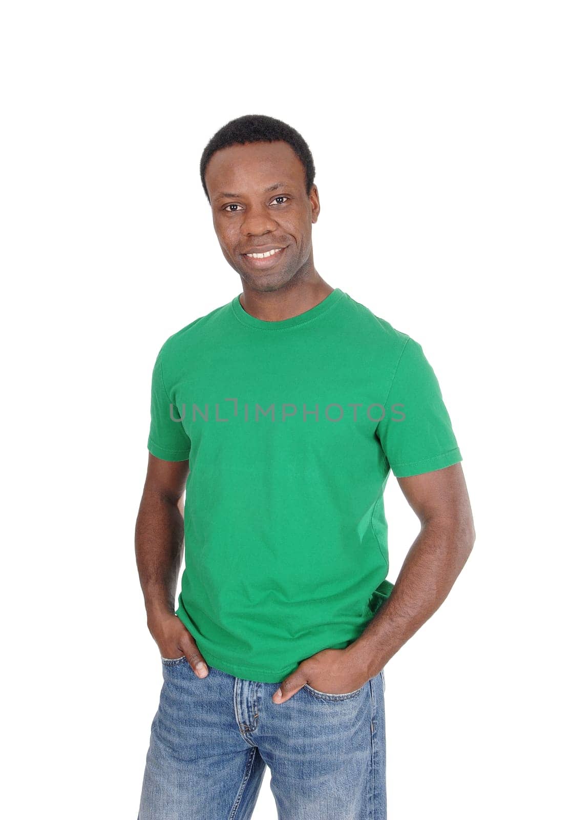A young happy African American man in a green t-shirt and jeans.standing smiling, isolated for white background.
