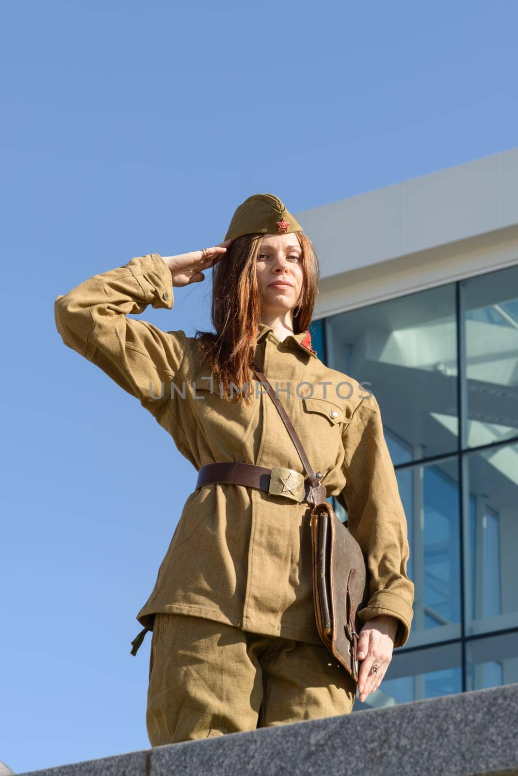 A girl in soviet uniform posing in Constitution square in Kharkiv, Ukraine