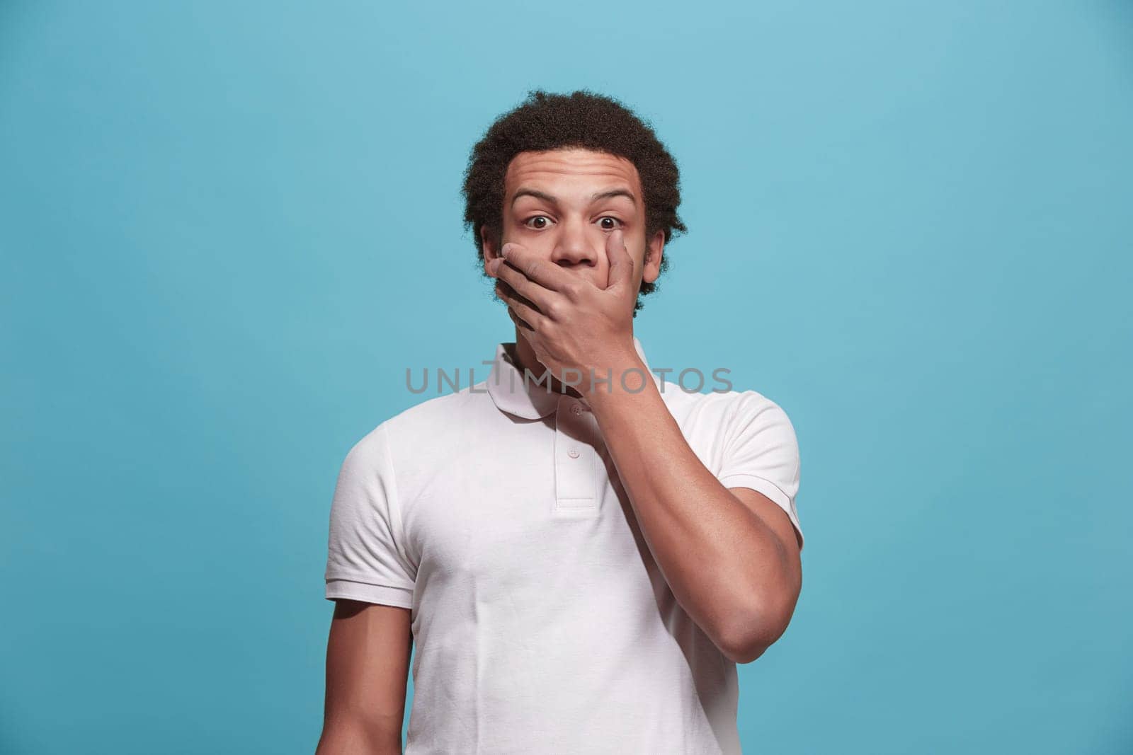 Wow. Attractive male half-length front portrait on pink studio backgroud. Young emotional surprised bearded man standing with open mouth. Human emotions, facial expression concept. Trendy colors