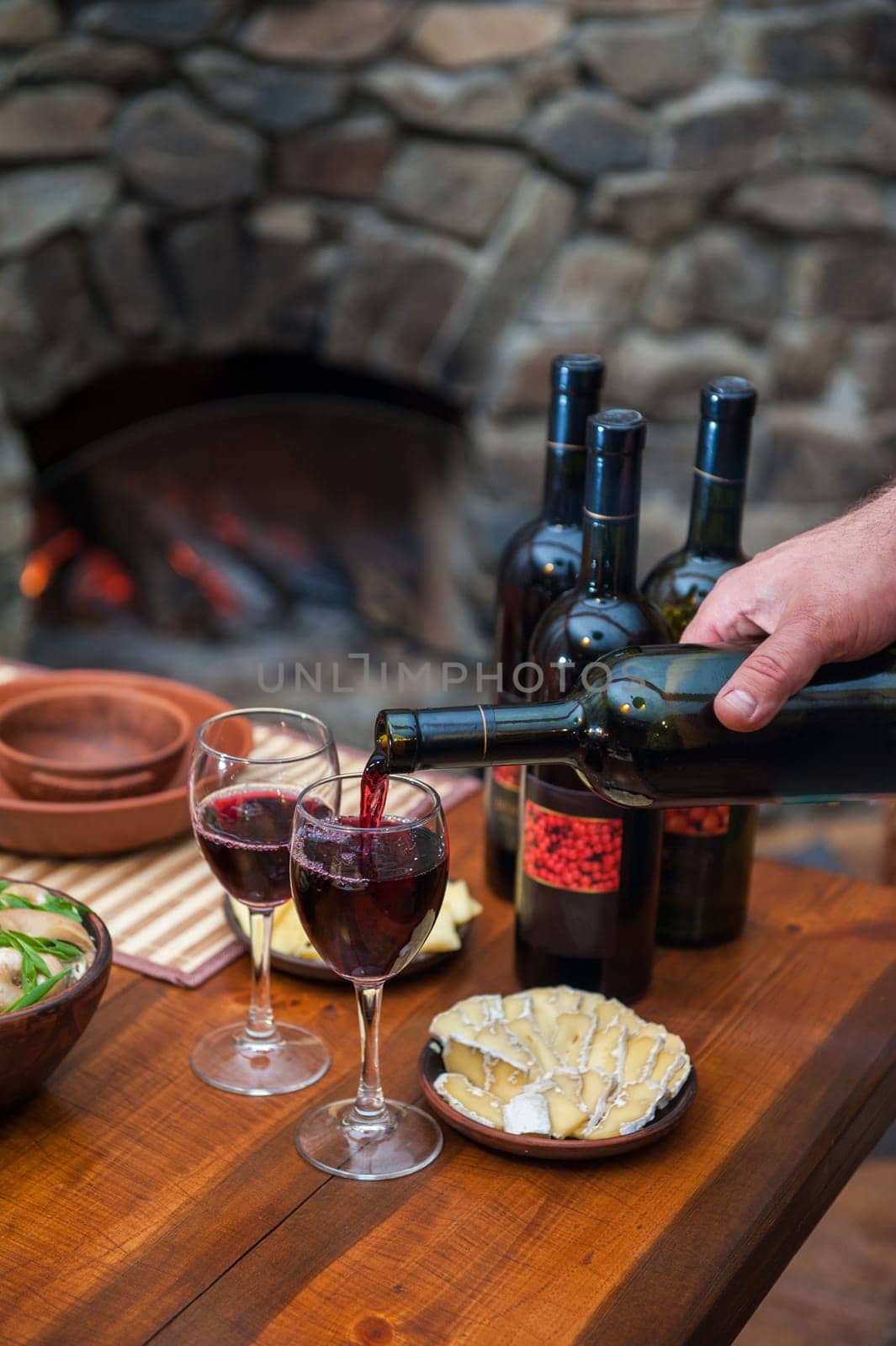Pouring red wine into the glass