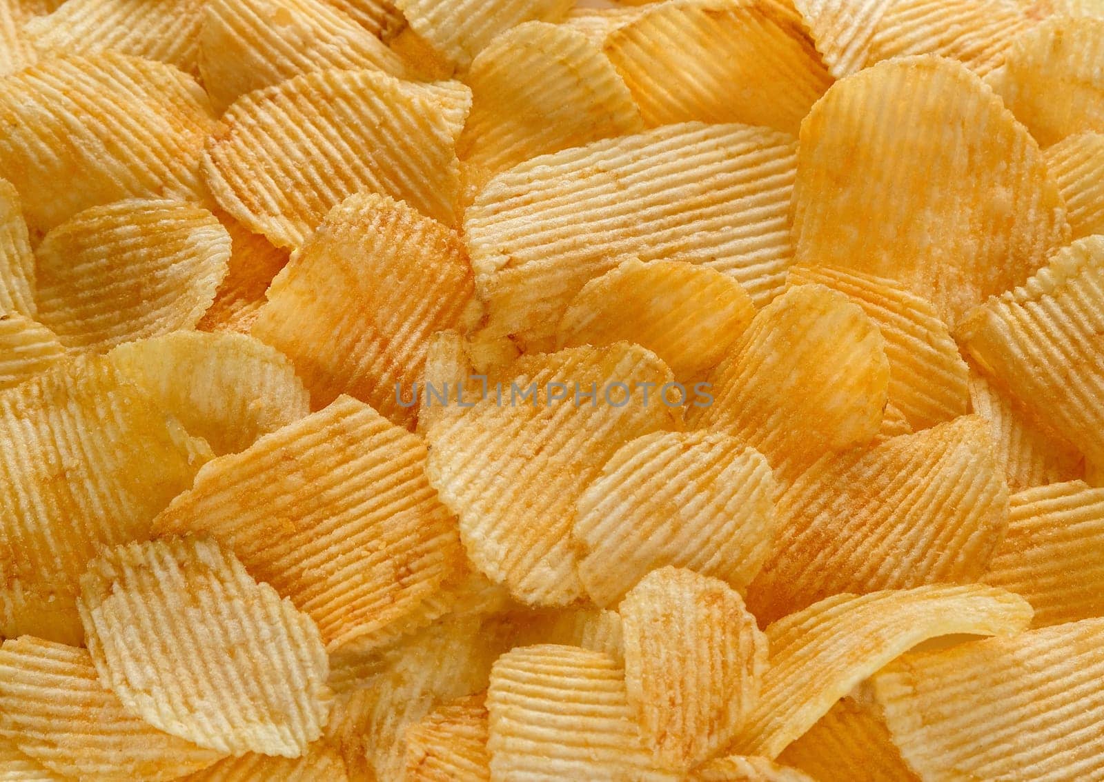 background of potato chips golden yellow
