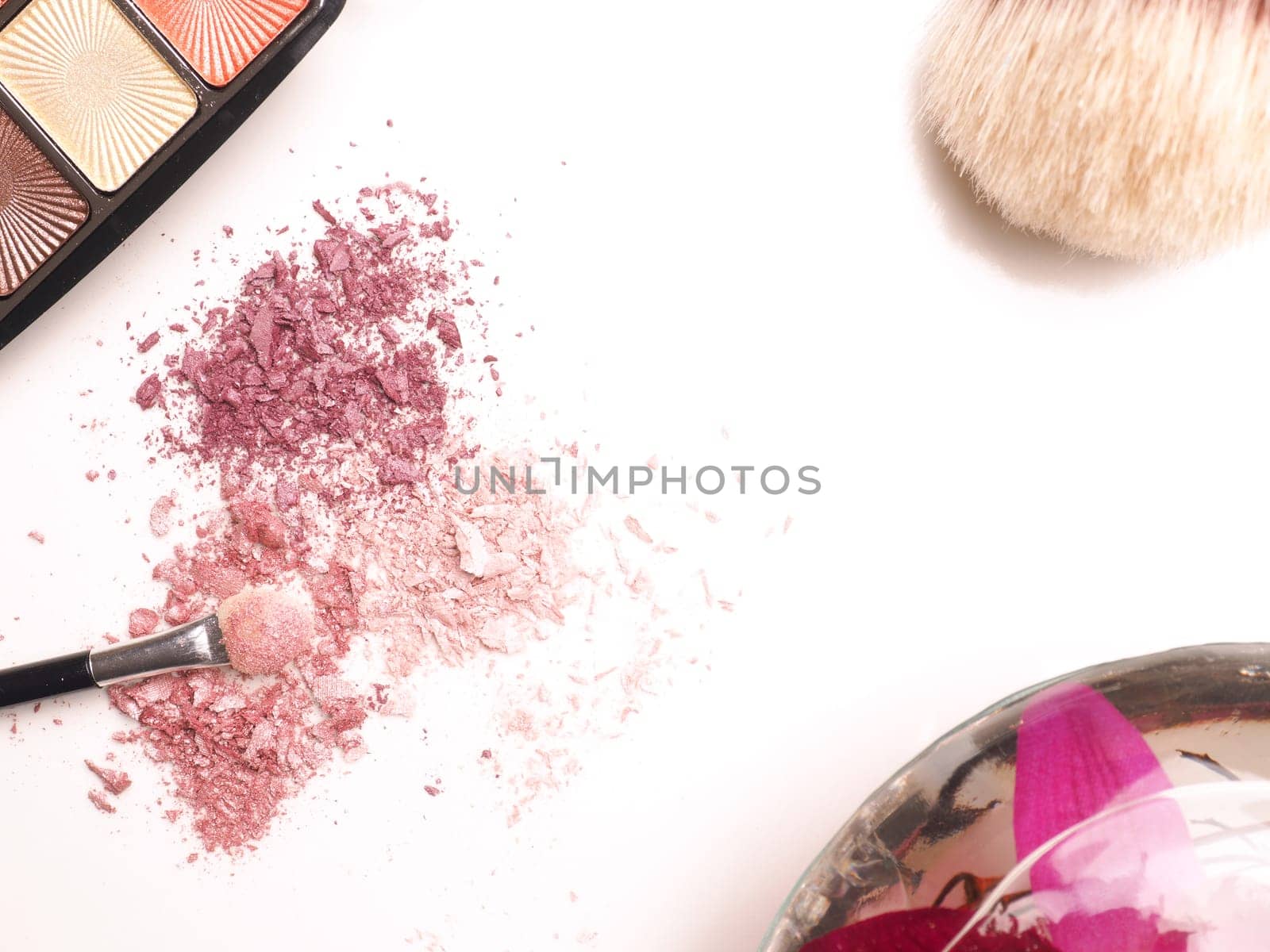 Close up of eye shadow on a white table, make up or fashion concept