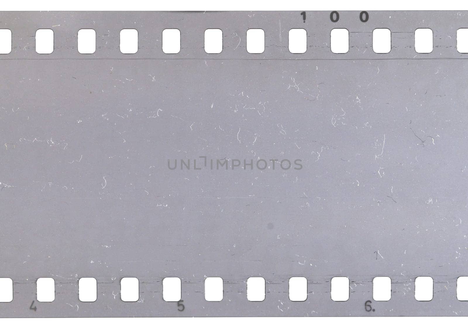 Strip of old celluloid film on white background