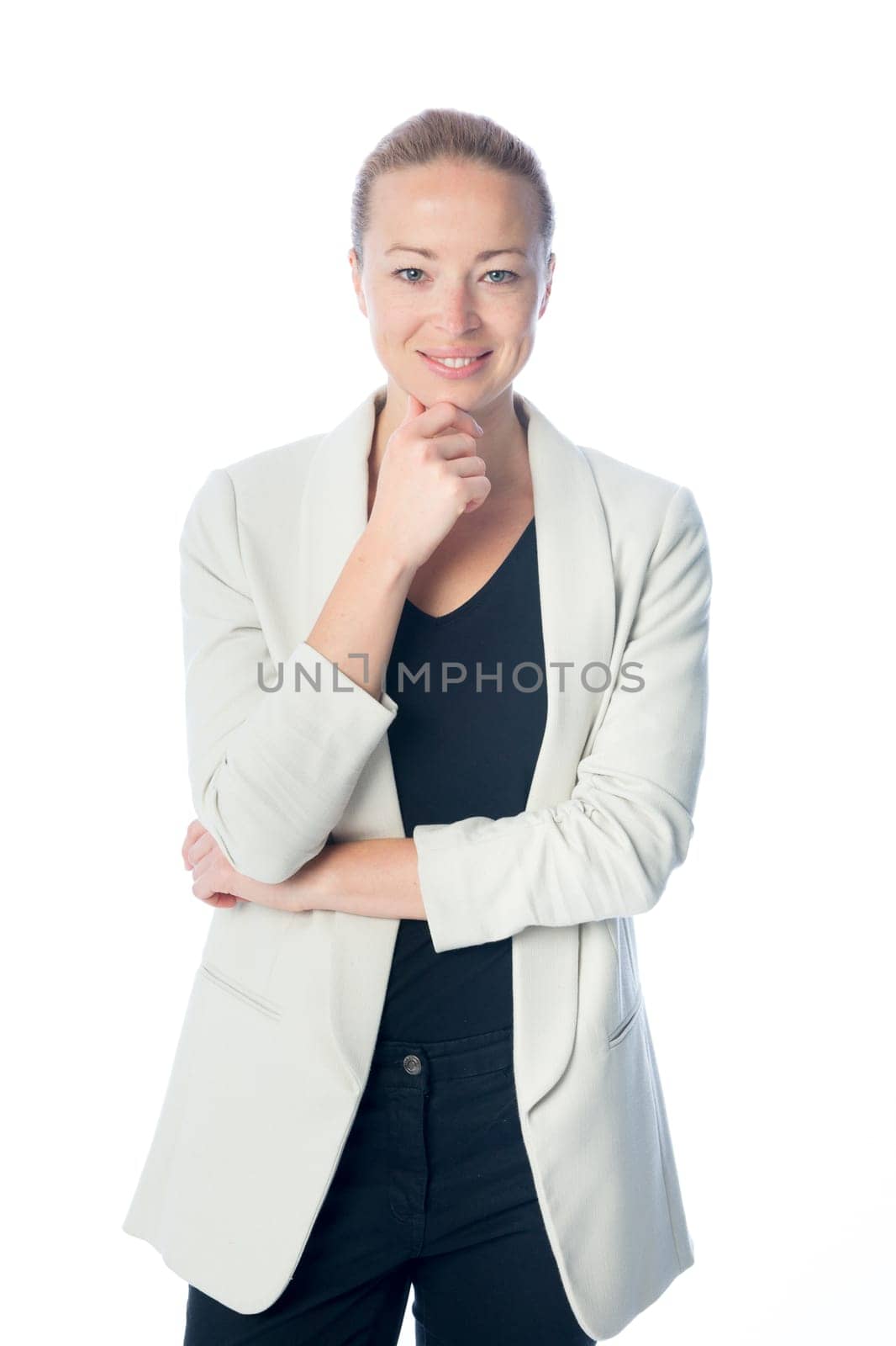 Portrait of casualy dressed,cheerful, beautiful, smart, young businesswoman in standing against white background.