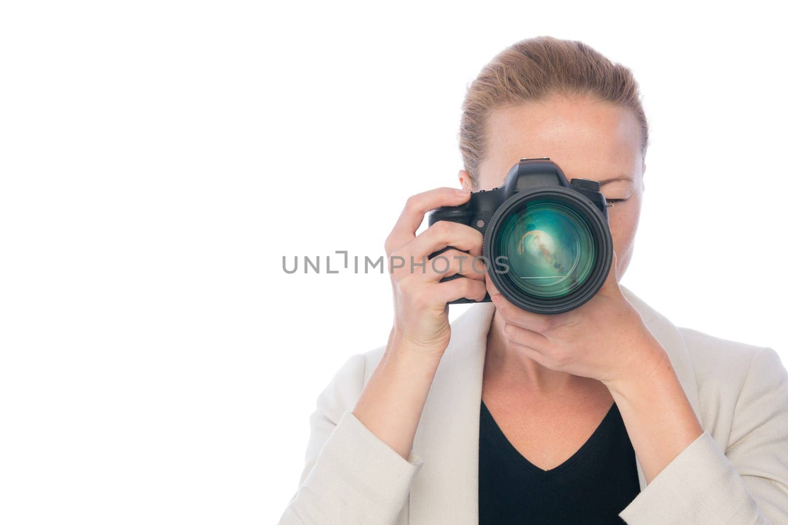Woman photographer taking images with dslr camera isolated on white background.