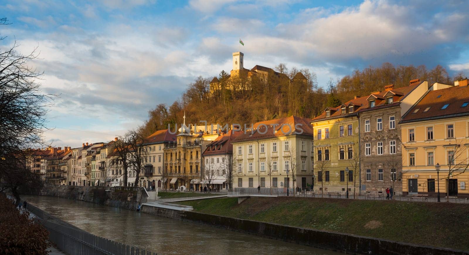 Sunset panorama of Ljubljana riverfront, architecture and castle, capital of Slovenia.