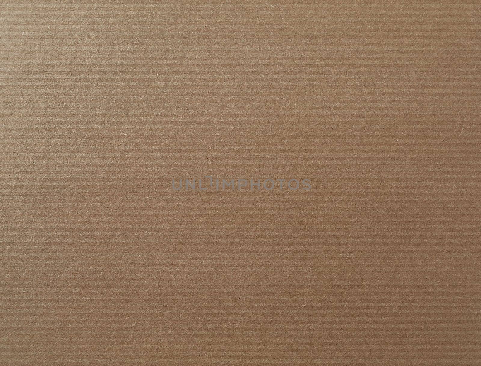 Brown striped paper texture. Kraft cardboard background.