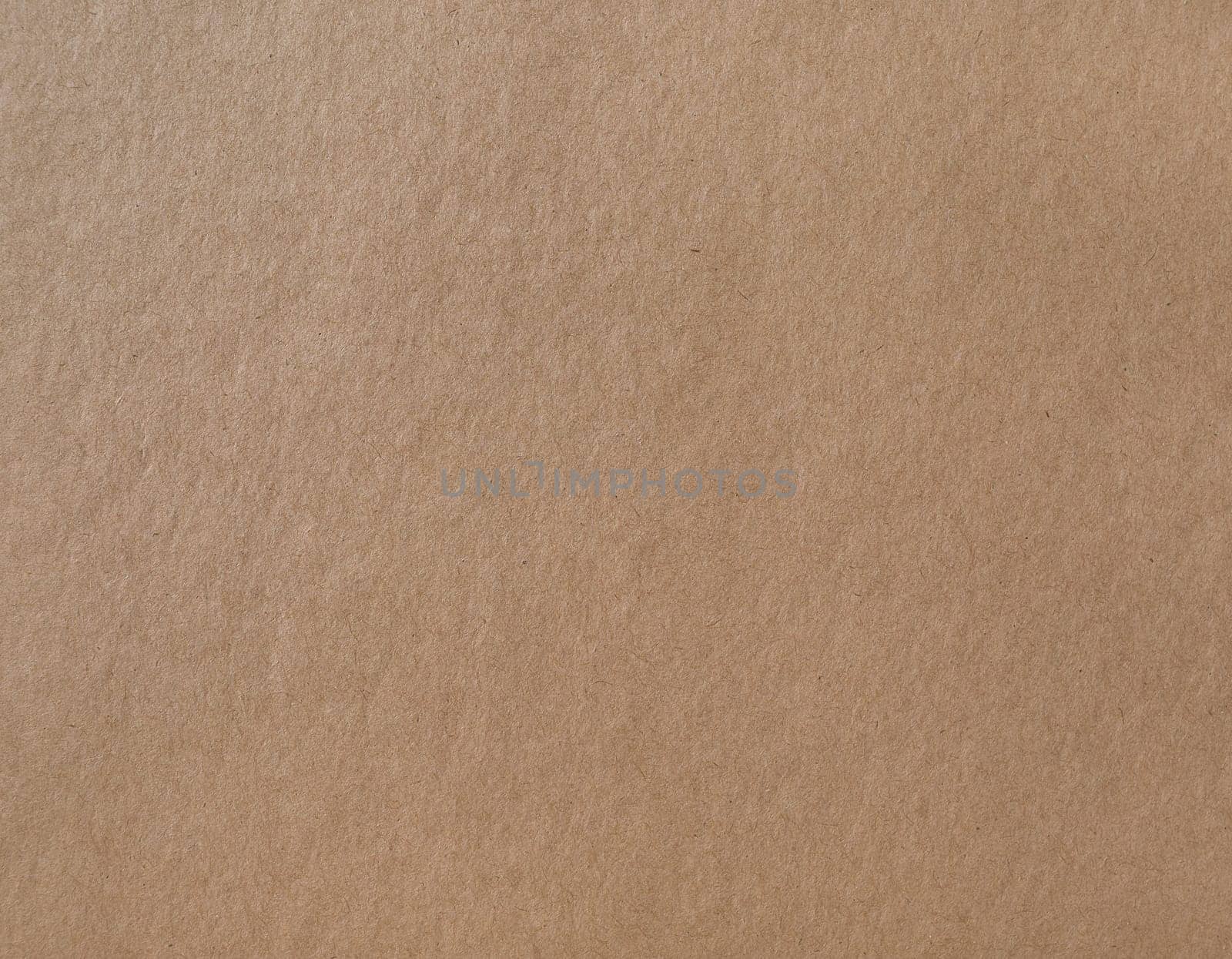 Wrapping paper texture. Kraft brown cardboard background.